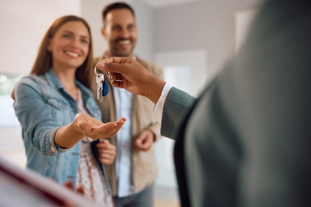 first home buyers receiving keys to their new home